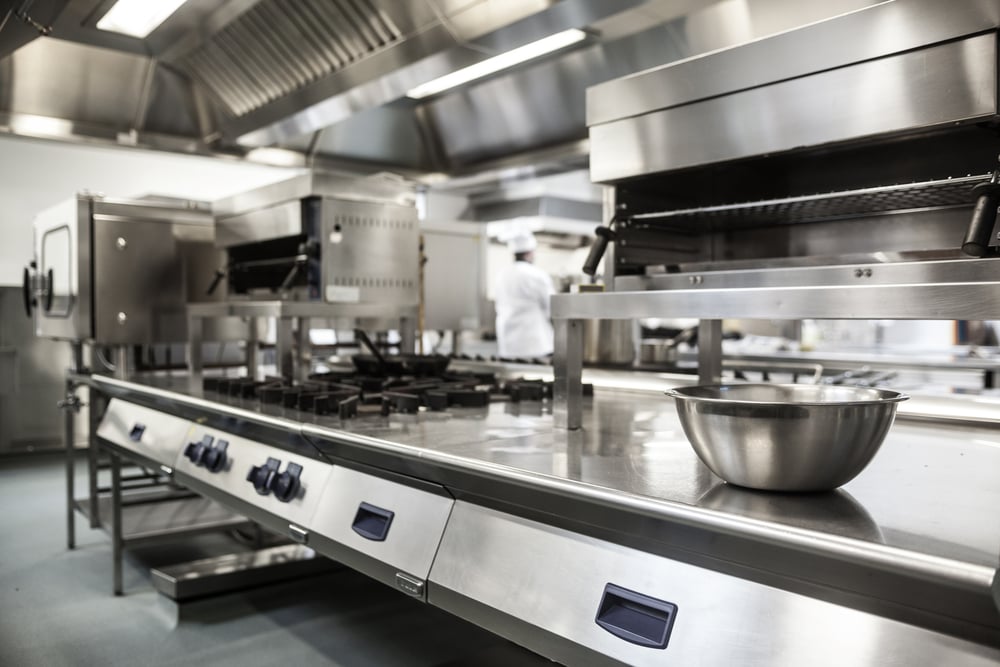 Clean restaurant kitchen ready for the dinner rush.